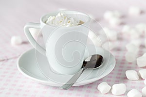 Cup of coffee or hot chocolate with whipped cream on the table a