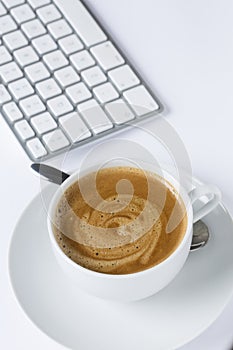 Cup of coffee with a keyboard