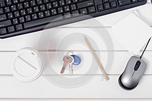 Cup of coffee keys paper for notes keyboard mouse from computer