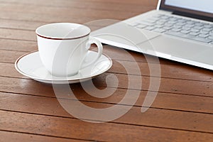 Cup of coffee and laptop