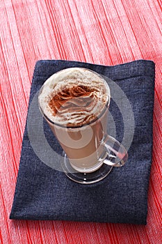 Cup of coffee latte cappucino on the red and blue