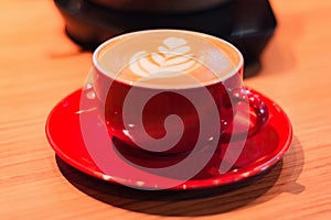 Cup of coffee latte on table with selective focus