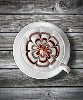 Cup of coffee latte on wood table