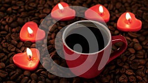 Cup coffee with lit candles in the shape of heart