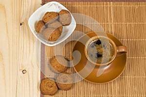 Cup of coffee and low-calorie cookies made from cereals
