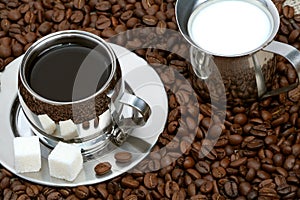 Cup of coffee with lump sugar photo