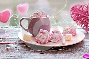 Cup of coffee with meringues and marshmallows, Turkish delight on a plate, hearts, illumination
