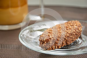 Cup of coffee with milk and chocolate cake