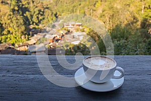 A cup of coffee with mountain view