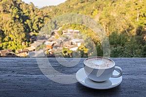 A cup of coffee with mountain view