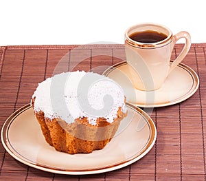 Cup of coffee and muffin on a plate