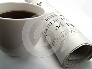 A cup of coffee and a newspaper