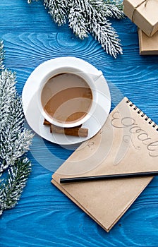 Cup of coffee and notebook with goals for new year