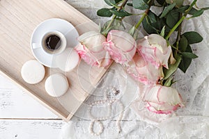 Cup of coffee, notebook and rose flowers. Vintage. Flat lay, top