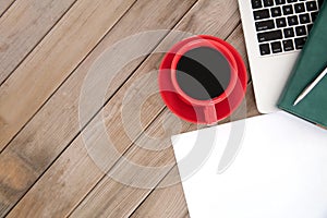 A cup of coffee and office tools