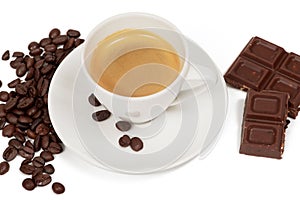 Cup of coffee and piece of chocolate and coffe beans on white background