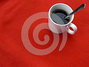 Cup of coffee on red