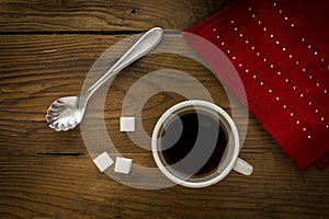 Cup of coffee and a red scarf.