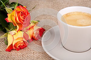 Cup of coffee red-yellow roses