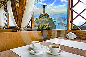 A Cup of coffee in a restaurant against the background of a beautiful landscape in the window