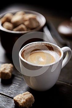 Cup of coffee on rustic wooden background