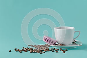 A cup of coffee on a saucer on a aquamarine background