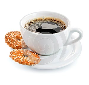 Cup of coffee on saucer with biscuits