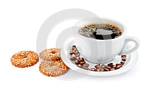 Cup of coffee on saucer with biscuits