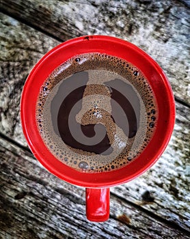 Cup of coffee on saucer with spoon