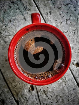 Cup of coffee on saucer with spoon