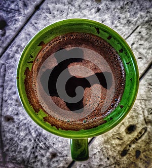 Cup of coffee on saucer with spoon