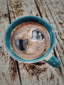 Cup of coffee on saucer with spoon