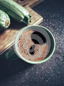 Cup of coffee on saucer with spoon