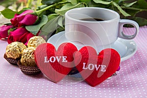 Cup of coffee, shape heart text love, chocolate, almonds