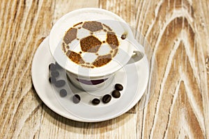 A cup of coffee with soccer ball