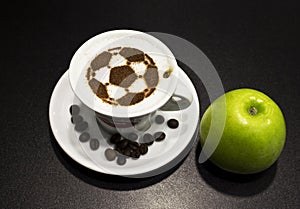 A cup of coffee with soccer ball