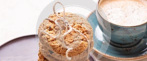 Cup of coffee, stack of oatmeal cookies on white wooden background Homemade bakery Gorisontal banner