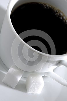 Cup of Coffee and Sugar Cubes