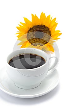 A cup of coffee with a sun flower