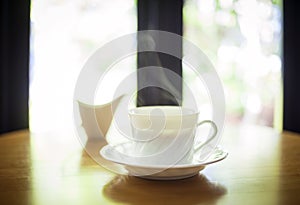 Cup of coffee on table in cafe interior