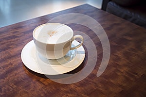 Cup of coffee on table cafe interior