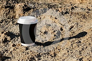 Cup of coffee on a table over blue sky and empty sea beachside. Summer holiday concept. Mock up, copy space