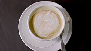 A cup of coffee on the table, Slow Motion Shot