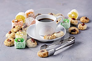 Cup of Coffee and Tasty Turkish Delight Oriental Dessert Lokum and Oriental Cookies Copy Space