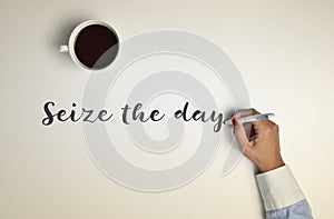 Cup of coffee and text seize the day