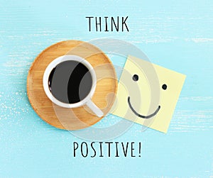 A cup of coffee with the text think positive