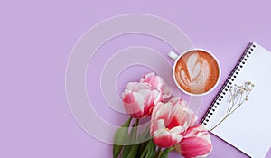 Cup of coffee. tulip flower celebration birthday on colored background romantic sprin