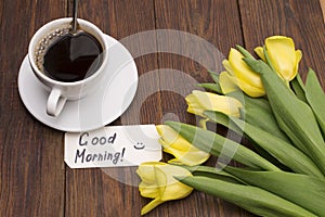 Cup of coffee, tulips and Good morning massage