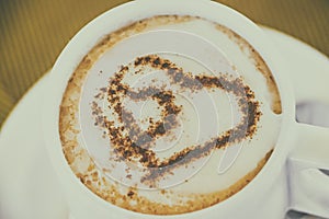 Cup of coffee with two hearts. It s symbol of Love in foam. It's a delicious sweet hot drink