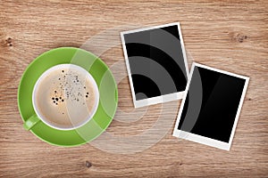 Cup of coffee and two photo frames